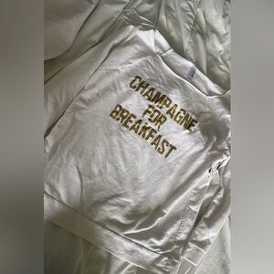 White Sweatshirt with Gold Text